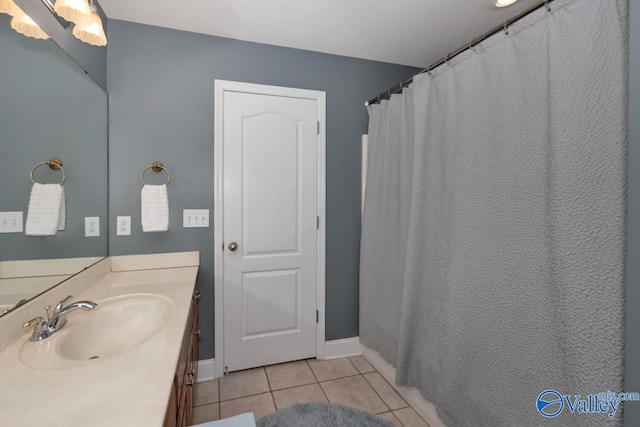 bathroom with tile patterned floors and vanity