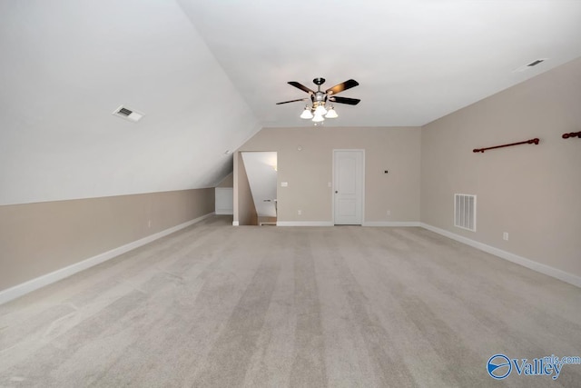 bonus room with light carpet, ceiling fan, and lofted ceiling