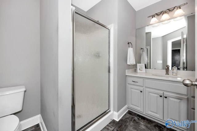 bathroom with a shower with door, vanity, and toilet