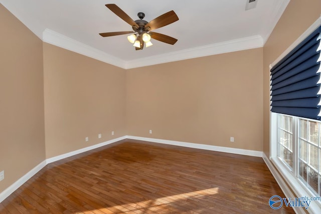 spare room featuring ceiling fan, dark wood-type flooring, and ornamental molding