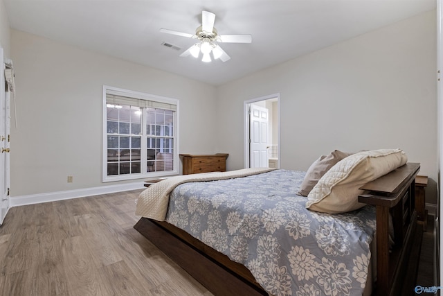 bedroom featuring light hardwood / wood-style flooring and ceiling fan