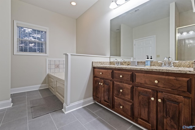 bathroom featuring independent shower and bath, vanity, and tile patterned floors