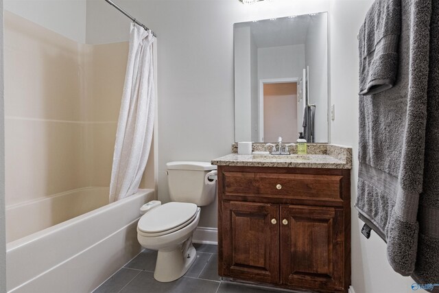 full bathroom with shower / bath combo with shower curtain, toilet, vanity, and tile patterned flooring