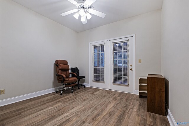 unfurnished office featuring ceiling fan and hardwood / wood-style floors