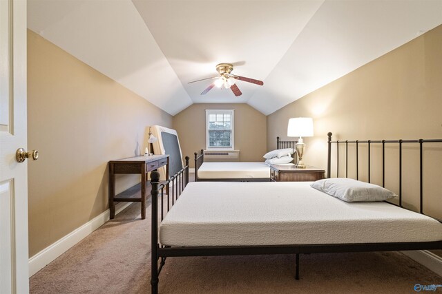 carpeted bedroom with lofted ceiling and ceiling fan