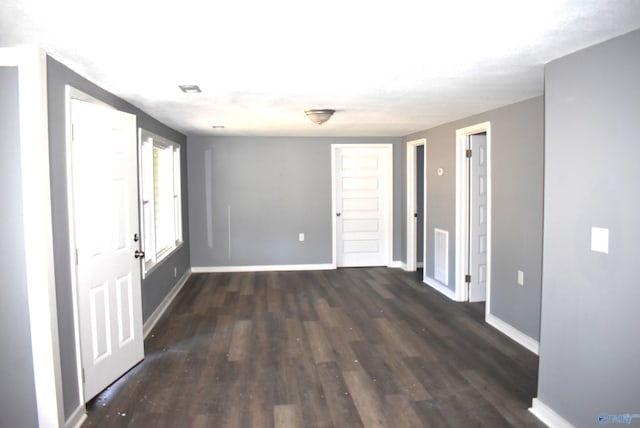 empty room featuring dark hardwood / wood-style floors