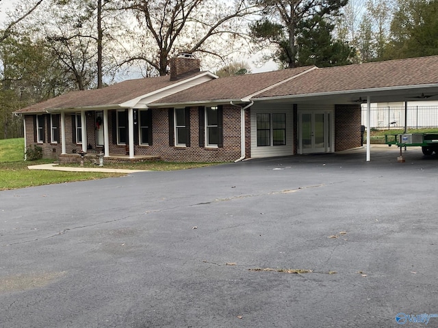 ranch-style home with a carport