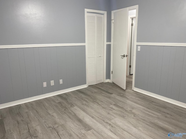 empty room with light hardwood / wood-style flooring