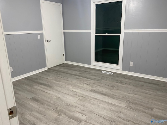 spare room featuring light hardwood / wood-style flooring
