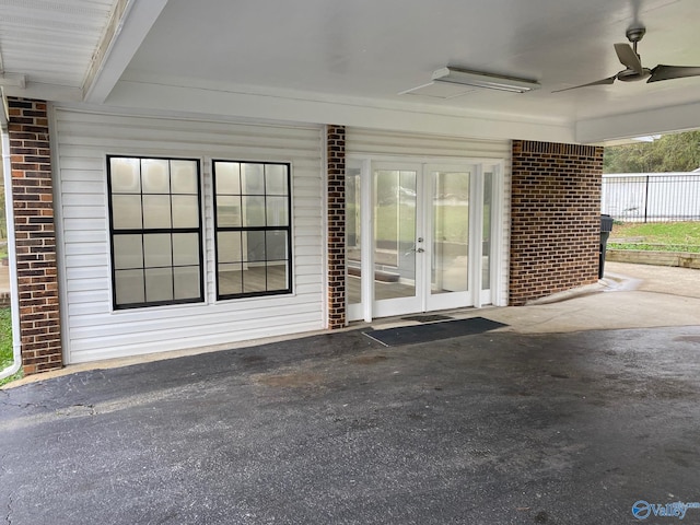 property entrance with ceiling fan and french doors