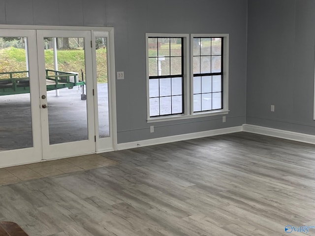 doorway with wood-type flooring and french doors
