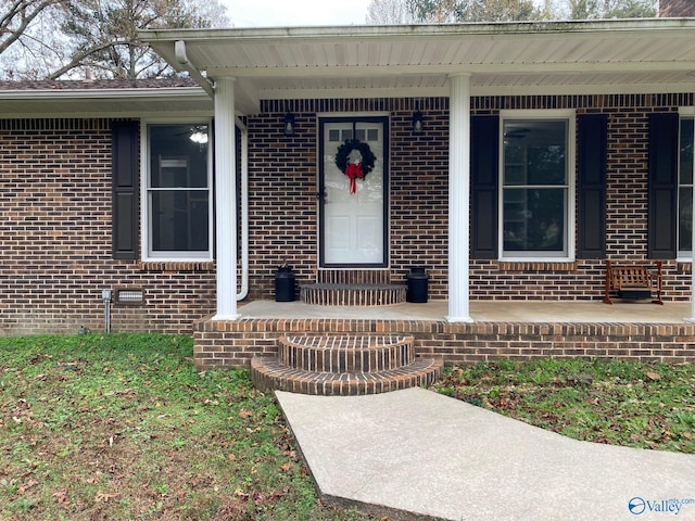 doorway to property featuring covered porch