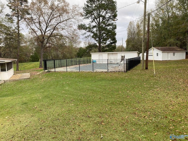view of yard with an outdoor structure and a swimming pool