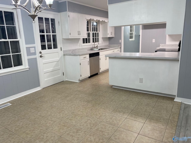 kitchen with crown molding, decorative light fixtures, sink, white cabinets, and stainless steel dishwasher