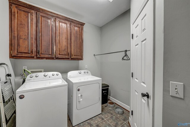 laundry area featuring cabinets and separate washer and dryer