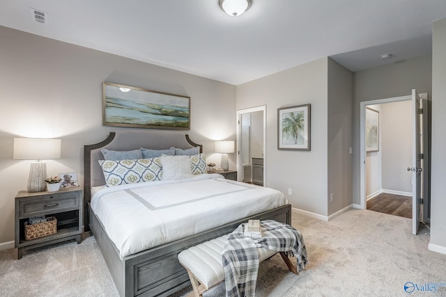 bedroom with baseboards, visible vents, and carpet flooring