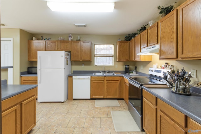 kitchen with sink and white appliances