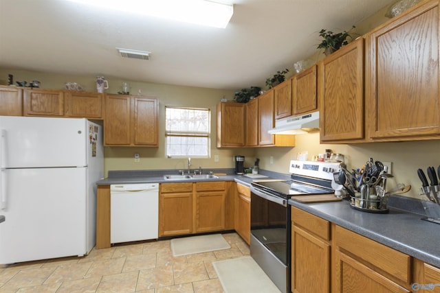 kitchen featuring sink and white appliances