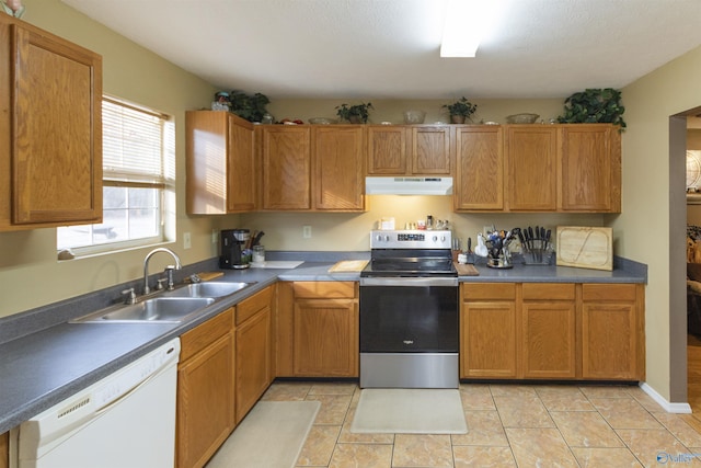 kitchen featuring light tile patterned flooring, stainless steel electric stove, sink, and white dishwasher