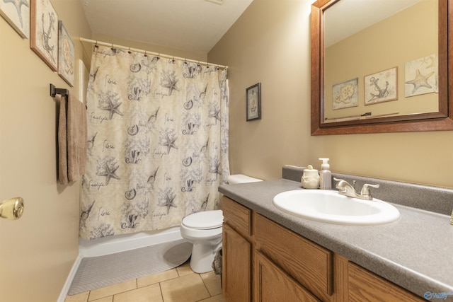 bathroom with tile patterned flooring, vanity, a shower with shower curtain, and toilet