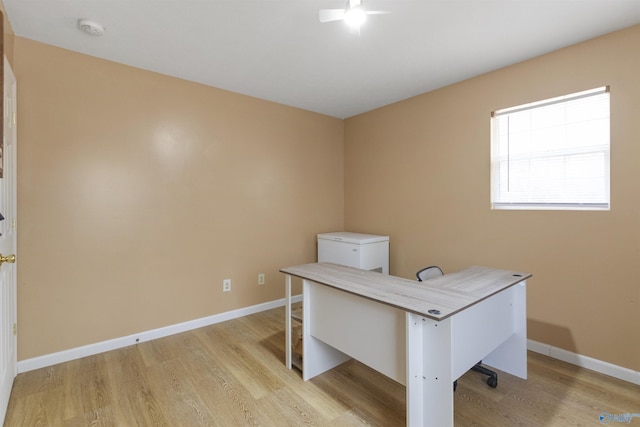 office area with light hardwood / wood-style floors