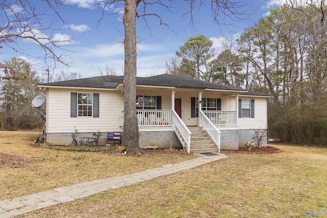 view of front facade with covered porch and a front yard