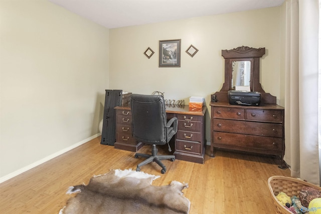 office space with light hardwood / wood-style flooring