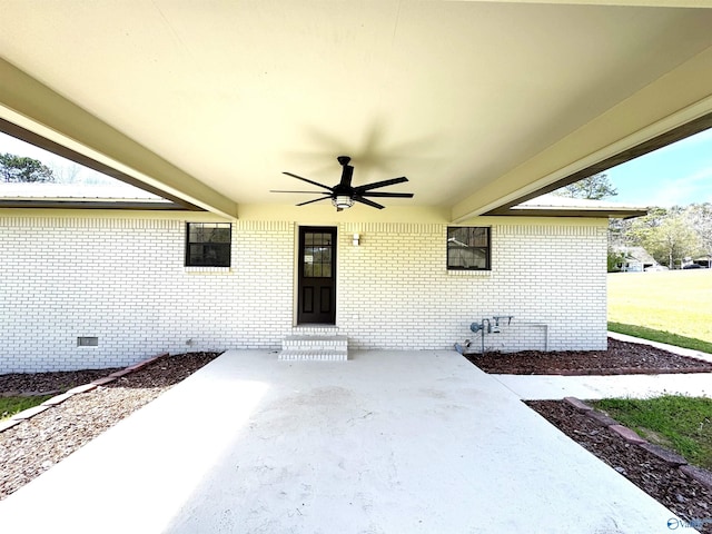 view of patio featuring entry steps and a ceiling fan