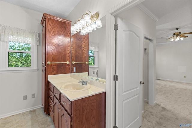 bathroom with ceiling fan and vanity