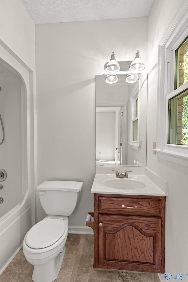 full bathroom with a chandelier, a textured ceiling, shower / bath combination, vanity, and toilet