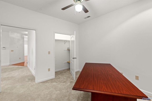 unfurnished office with light carpet and ceiling fan