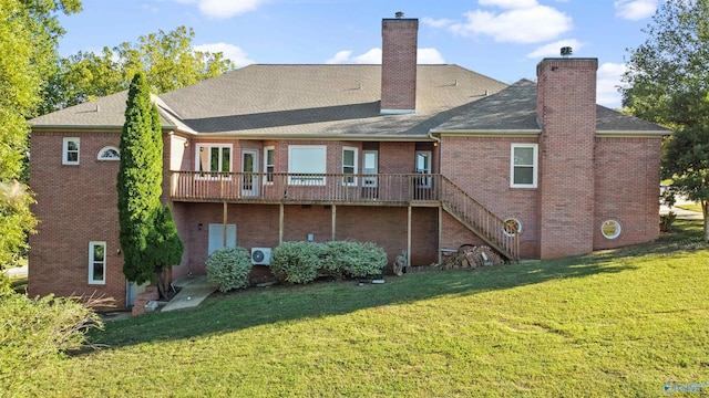 back of house with a lawn