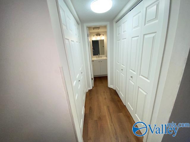 hallway featuring hardwood / wood-style flooring