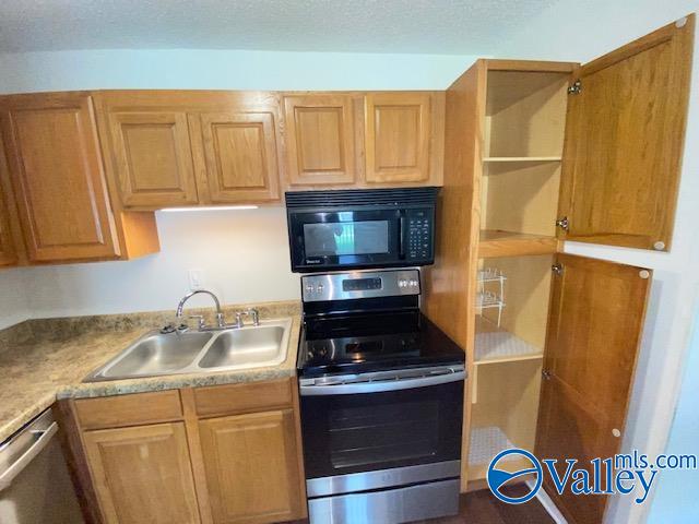 kitchen with sink and stainless steel appliances