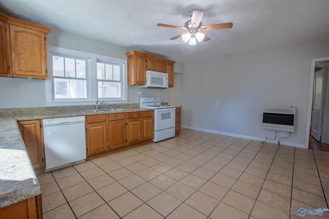 kitchen with white appliances, heating unit, ceiling fan, sink, and light tile patterned flooring