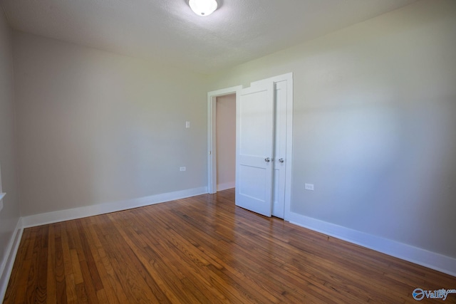 unfurnished room featuring wood-type flooring