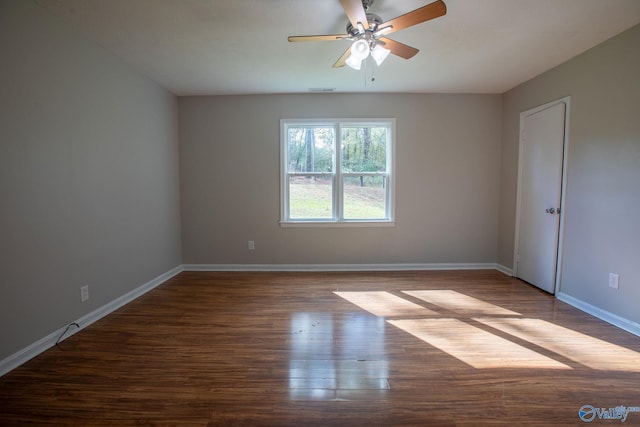 spare room with ceiling fan and hardwood / wood-style floors