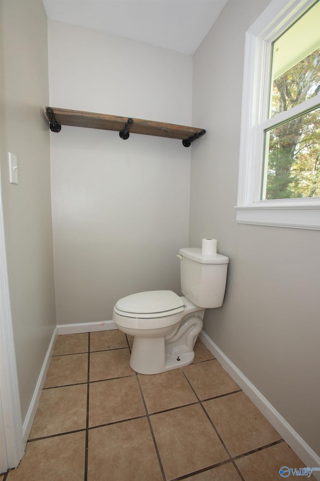 bathroom featuring tile patterned floors and toilet