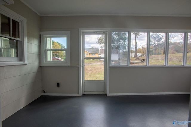 unfurnished room featuring ornamental molding