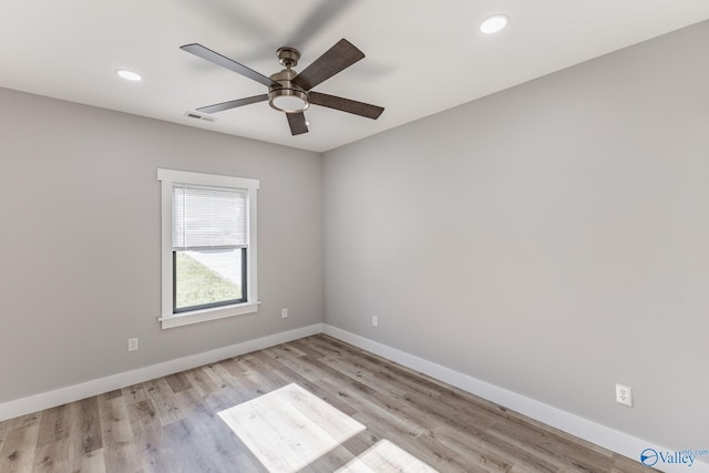 spare room featuring ceiling fan and light wood-type flooring