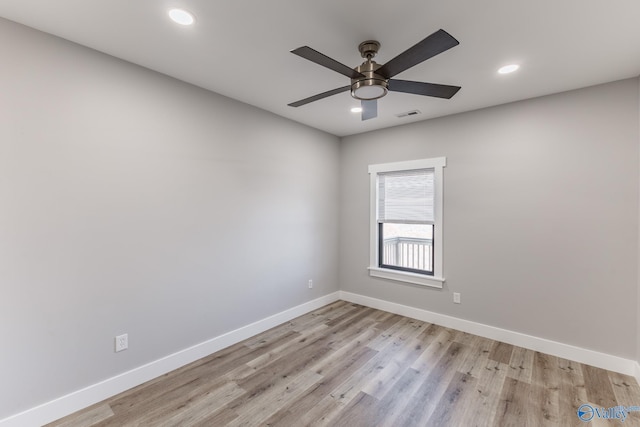 empty room featuring ceiling fan and light hardwood / wood-style floors