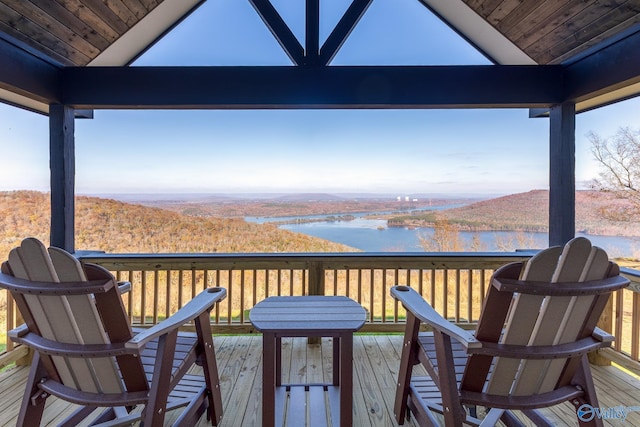 wooden deck featuring a water view