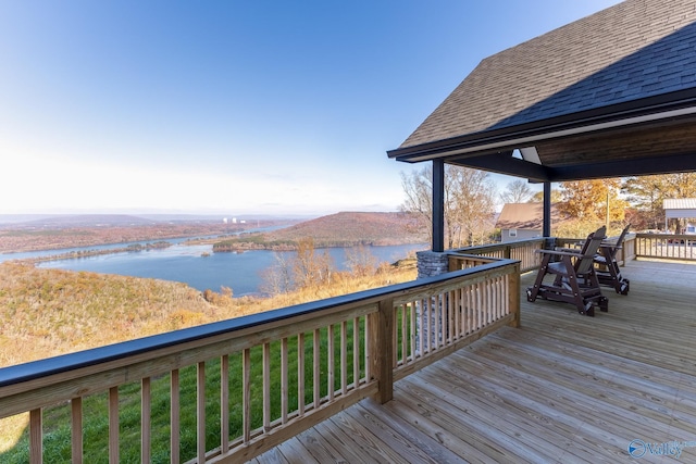 wooden deck with a water view