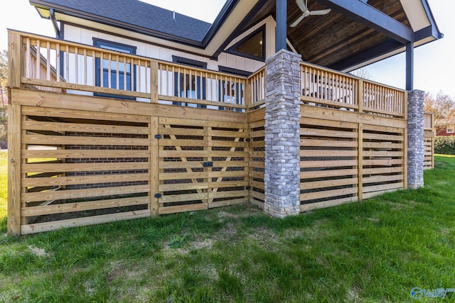 view of side of home with a yard