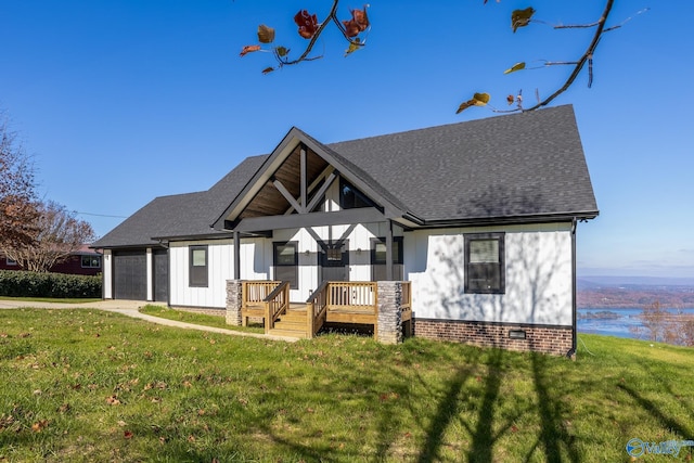 view of front of property with a garage and a front lawn