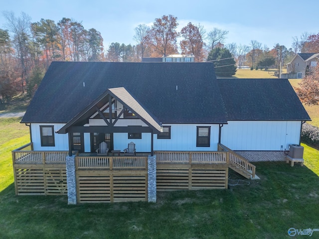 back of house with a yard, a deck, and central air condition unit