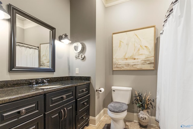 bathroom featuring tile patterned floors, vanity, toilet, and ornamental molding