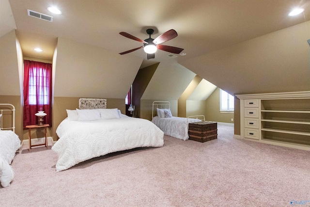 bedroom with light carpet, ceiling fan, visible vents, and lofted ceiling