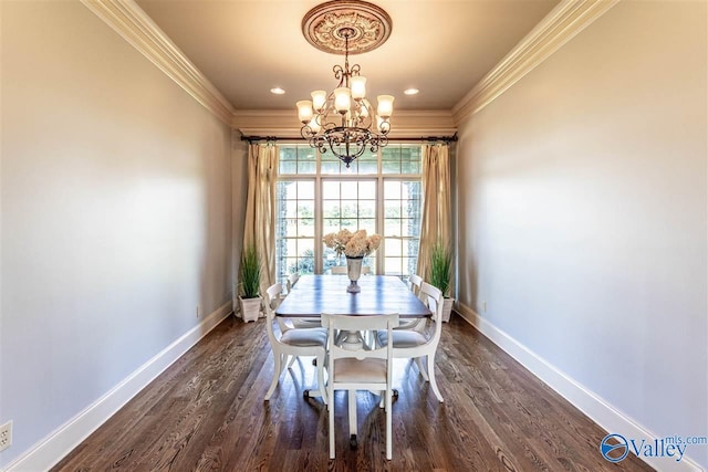 dining room featuring crown molding, dark wood-type flooring, a chandelier, and baseboards