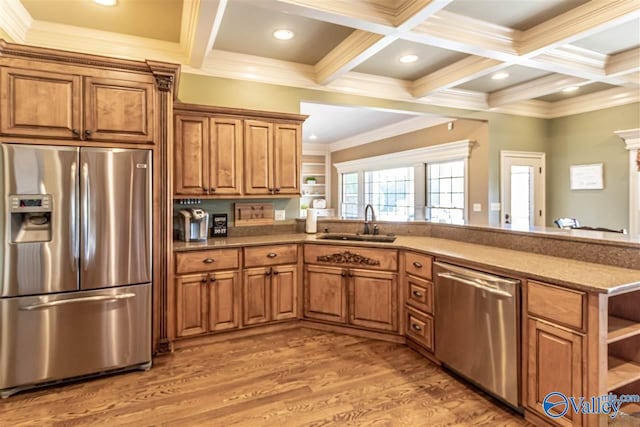 kitchen featuring wood-type flooring, ornamental molding, sink, and appliances with stainless steel finishes